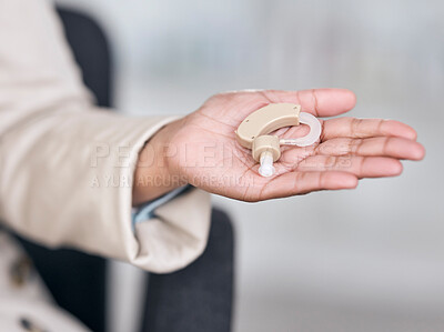 Buy stock photo Hearing aid, medical and deaf with hands of person with a disability for healthcare, technology and sound waves. Medicine, wellness and audio with closeup of cochlear implant for hearing treatment