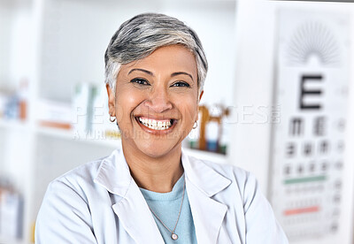 Senior woman, pharmacy worker and portrait with a smile and happy from healthcare job. Eye health, medical employee and elderly person with confidence from hospital or clinic work of pharmacist