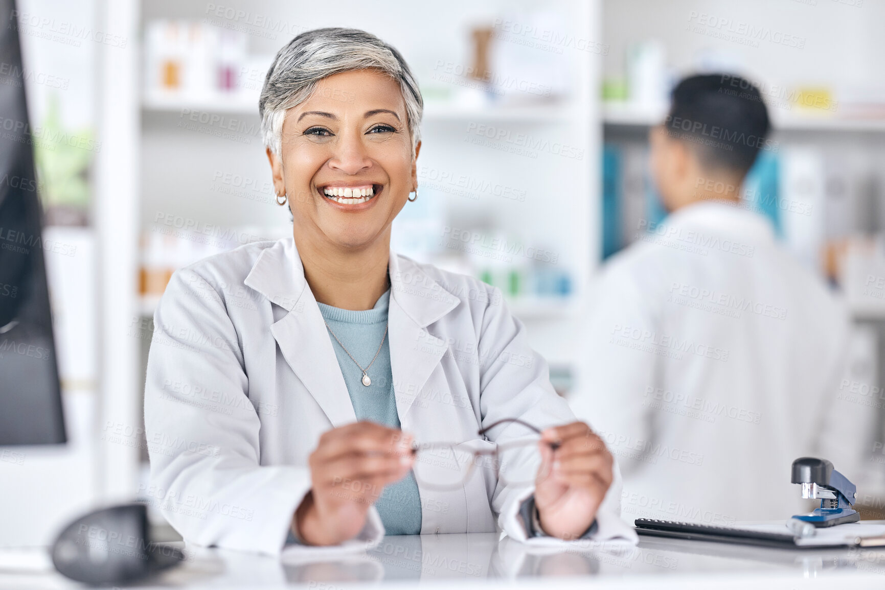 Buy stock photo Senior woman, pharmacy counter and portrait with a smile and happy from healthcare job. Eye health, medical employee and elderly person with confidence from hospital or clinic work of pharmacist