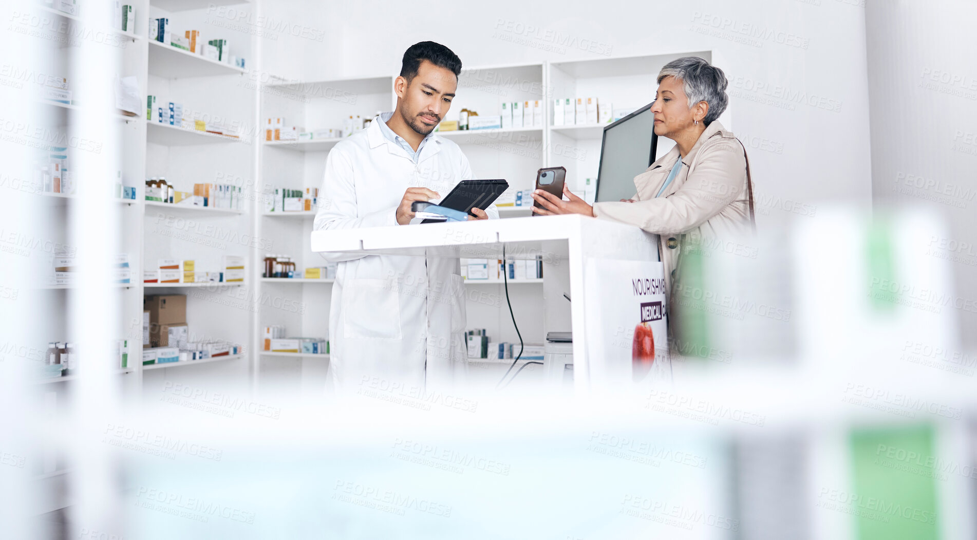 Buy stock photo Pharmacy, POS and senior woman with healthcare, medical and clinic worker with phone instructions. Customer, mobile and consultation with pharmacist and tablet and online information with support