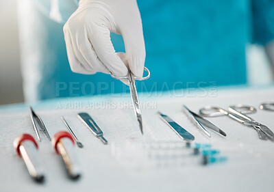 Buy stock photo Surgery equipment, table and hands with scissors for a medical procedure in theater. Closeup, hospital and a doctor or surgeon with gear for healthcare, operation or an emergency service in nursing