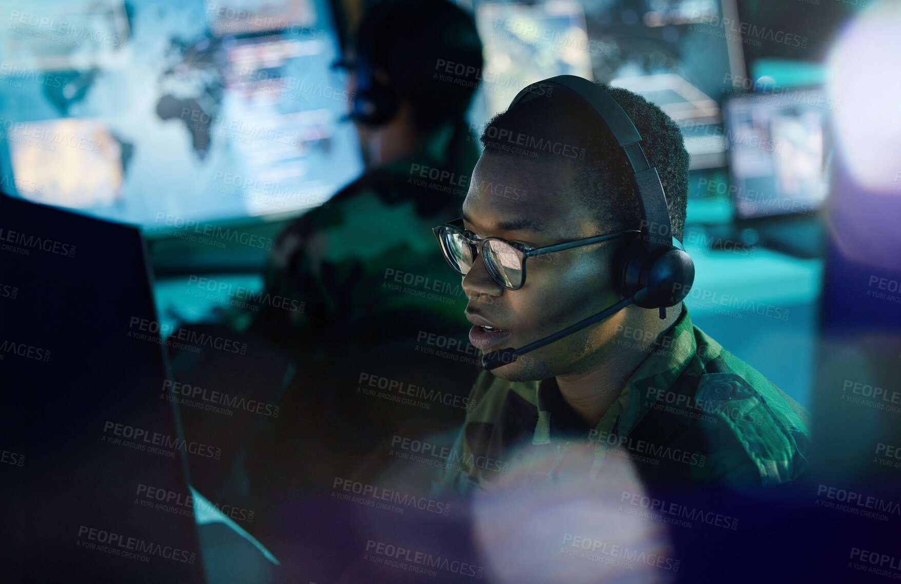 Buy stock photo Military control room, computer and man with headset, support or tech for communication. Security, surveillance and soldier at help desk in army office at government cyber intelligence command center