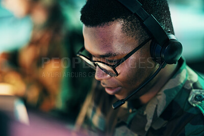 Buy stock photo Military control room, surveillance and man monitor, reading or check CCTV, army communication or security. Headset, emergency consultation and face of African soldier consulting on intel support