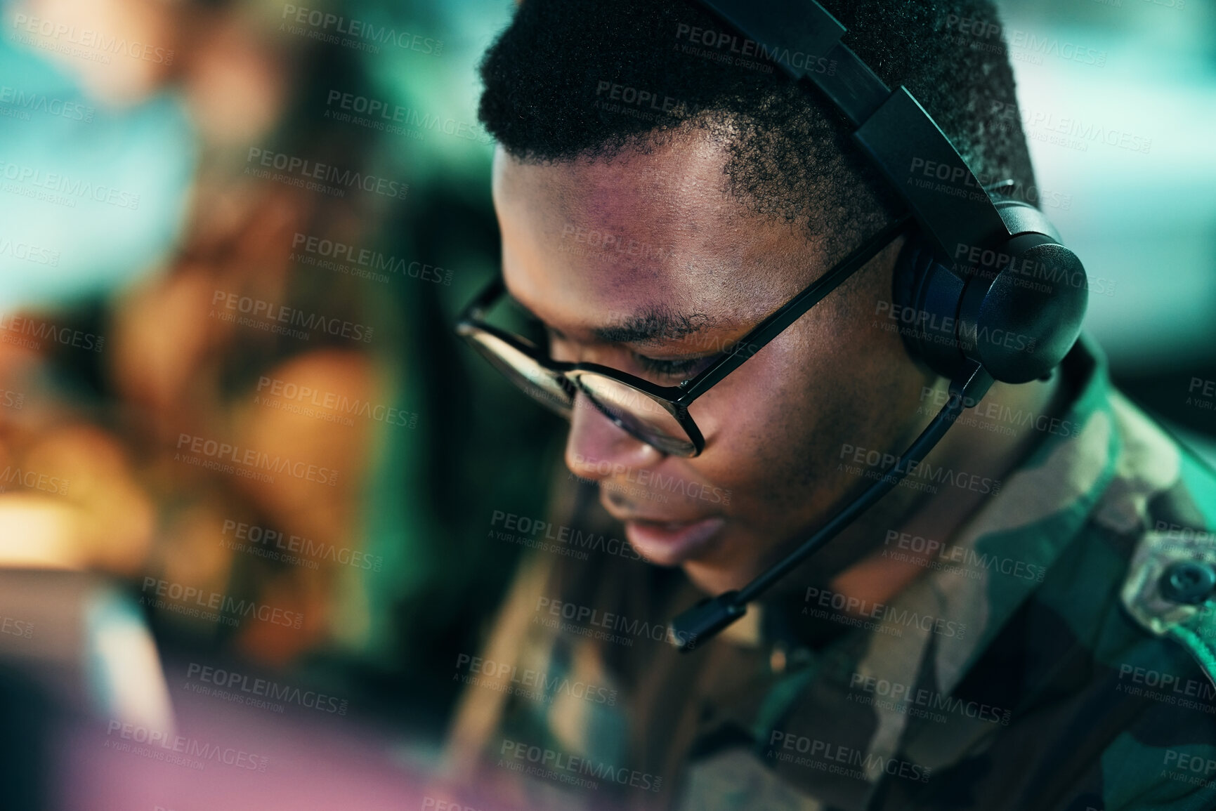 Buy stock photo Military control room, surveillance and man monitor, reading or check CCTV, army communication or security. Headset, emergency consultation and face of African soldier consulting on intel support