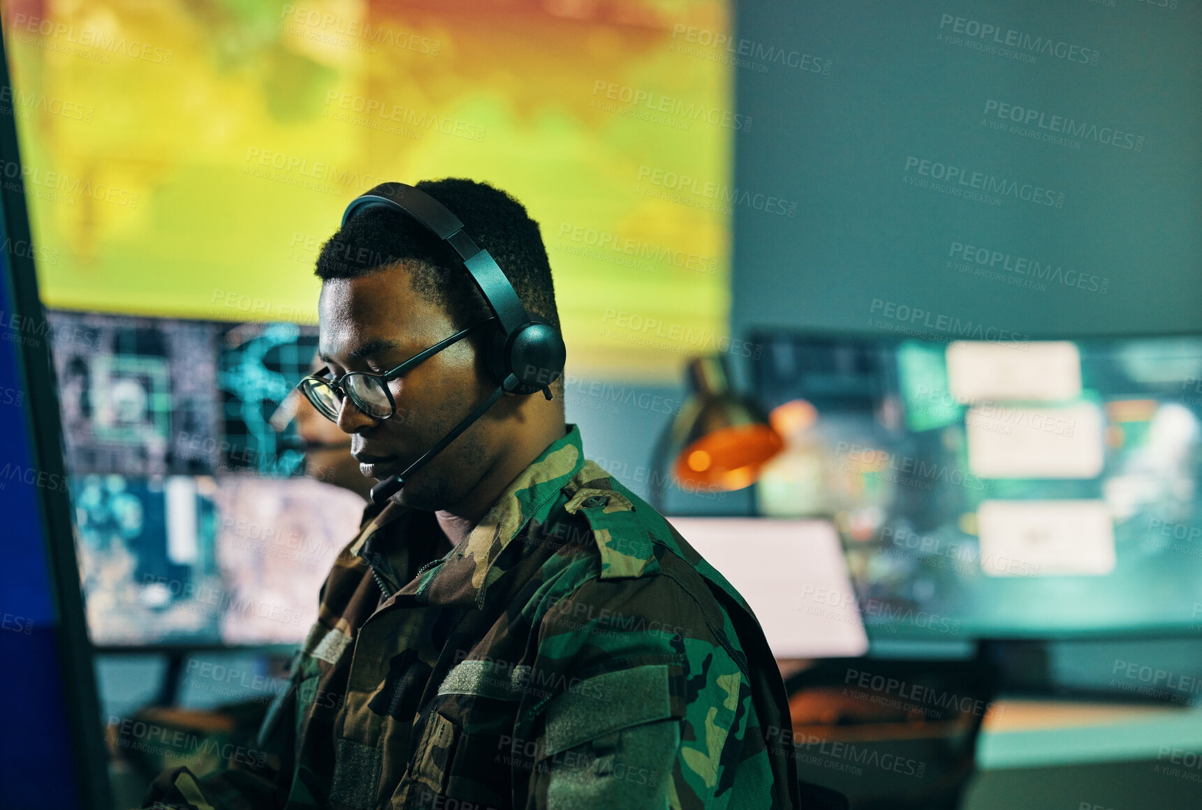 Buy stock photo Military, control room and man on computer in office, data center and monitor for technical support, cybersecurity or surveillance. Army, officer and work in tech, security or government communication