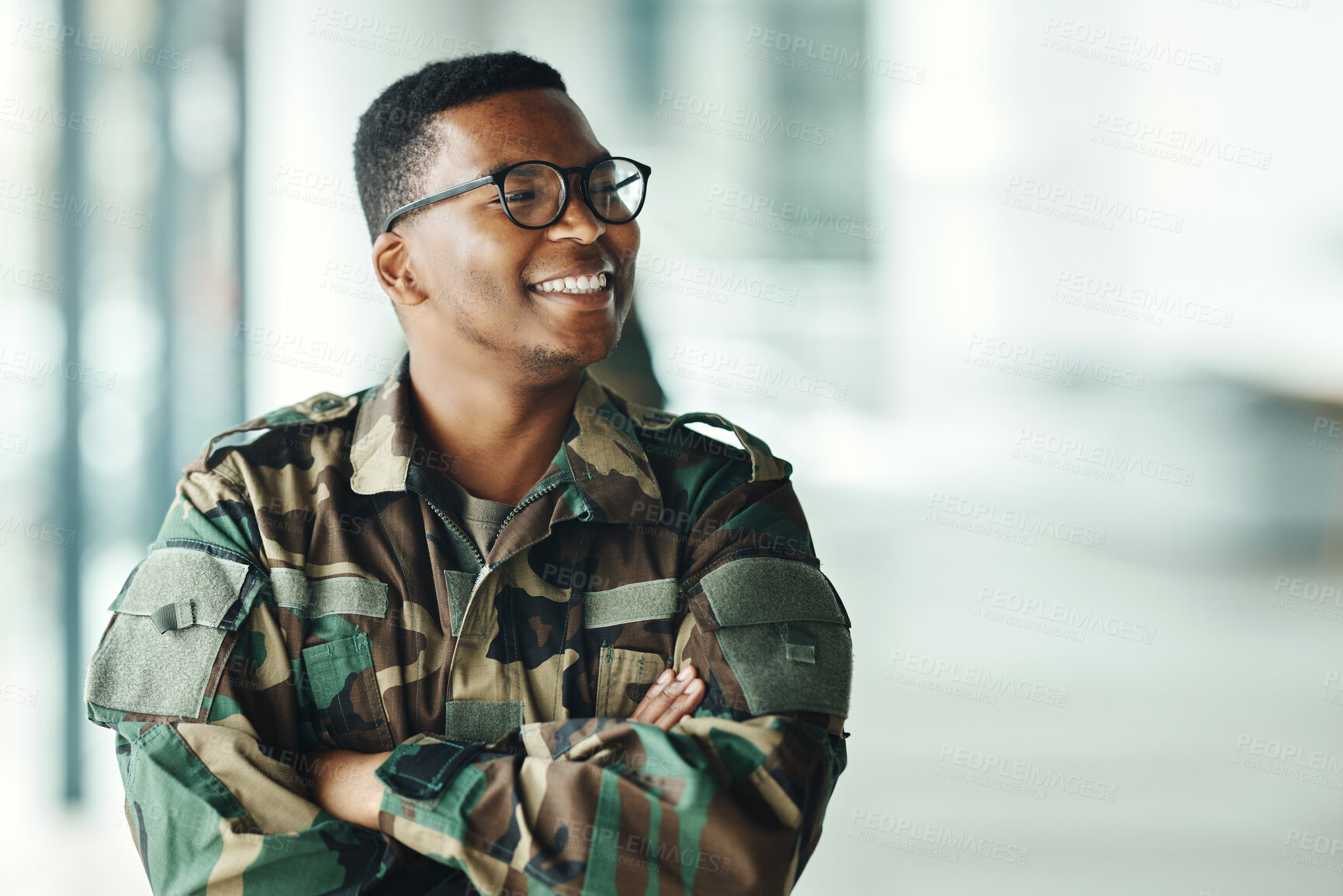 Buy stock photo Soldier with smile, confidence and arms crossed at army building, pride and happy professional in sevice. Military career, security and courage, black man in camouflage uniform at government agency.