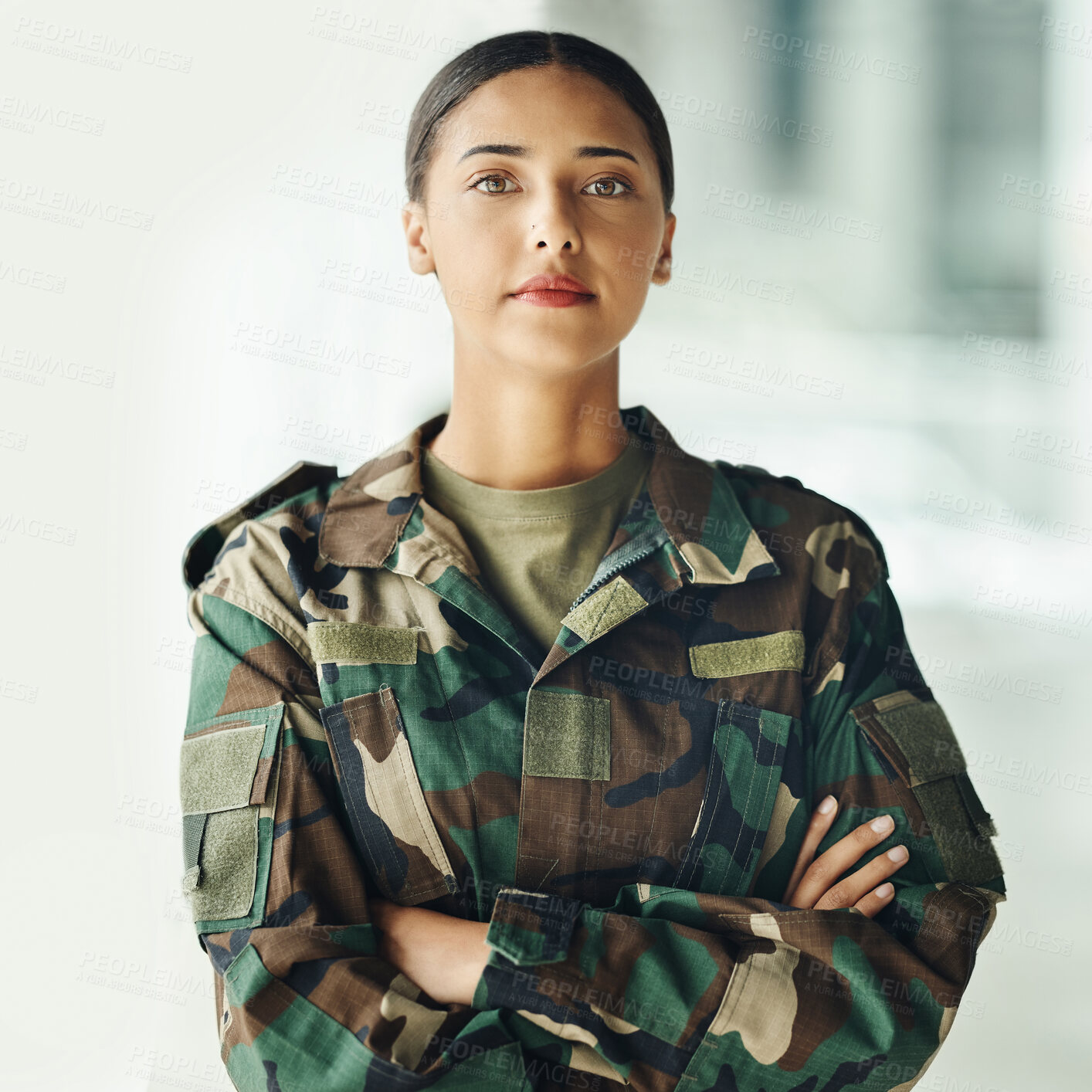 Buy stock photo Confident soldier portrait, woman and arms crossed in army building, pride and professional hero service. Military career, security and courage, proud girl in camouflage uniform at government agency.