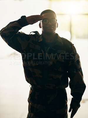 Buy stock photo Confident soldier portrait, army and salute in building with pride, professional hero and night service. Military career, security and courage, black man in camouflage uniform at government agency.