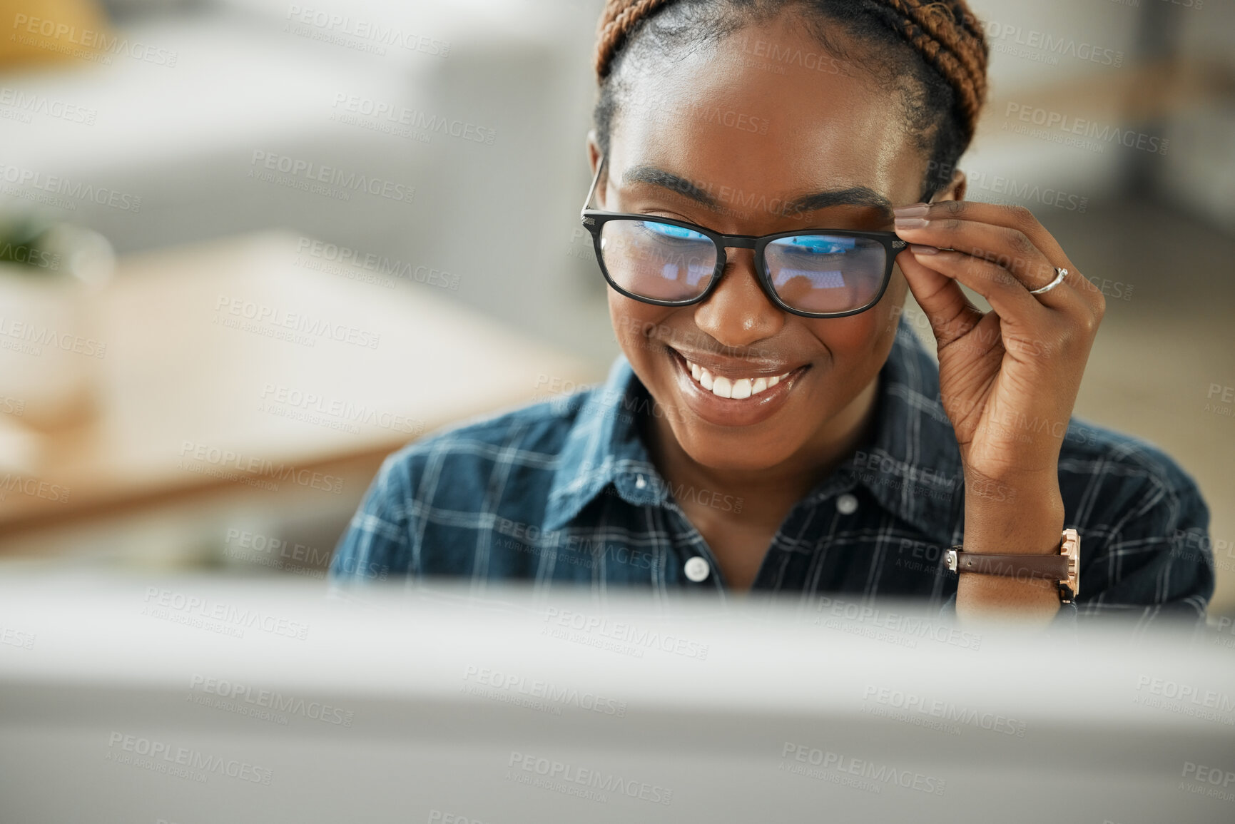 Buy stock photo Face, smile and computer with a black woman in glasses working closeup in her home for remote employment. Happy, website and desktop with a young employee at work on her small business startup
