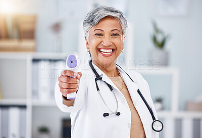 Buy stock photo Portrait, woman and doctor with infrared thermometer to check temperature, test fever and safety in hospital. Happy mature healthcare professional with laser, scanner and medical consulting for virus