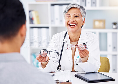 Buy stock photo Optometrist, office and talking to patient with glasses in hands for vision on tech, screen or lens for protection of eyes. Optometry, consultation and doctor with advice, tablet or choice in eyewear