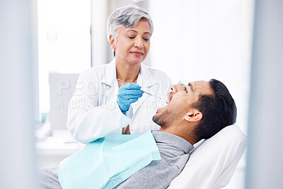 Buy stock photo Woman, dentist and check teeth of man with tools for dental cosmetics, healthcare assessment and medical consulting. Patient, tooth and oral cleaning with mirror, excavator and orthodontic surgery 