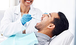 Man, dentist and check teeth with tools for dental cosmetics, healthcare assessment or medical consulting. Patient, tooth or open mouth in oral cleaning with mirror, excavator or orthodontics surgery