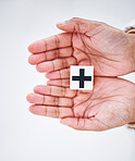 Healthcare, insurance and hands with cross sign for medical service, care and safety on white background. Hospital, symbol and person with emoji, shape and icon for help, support aid and medicine