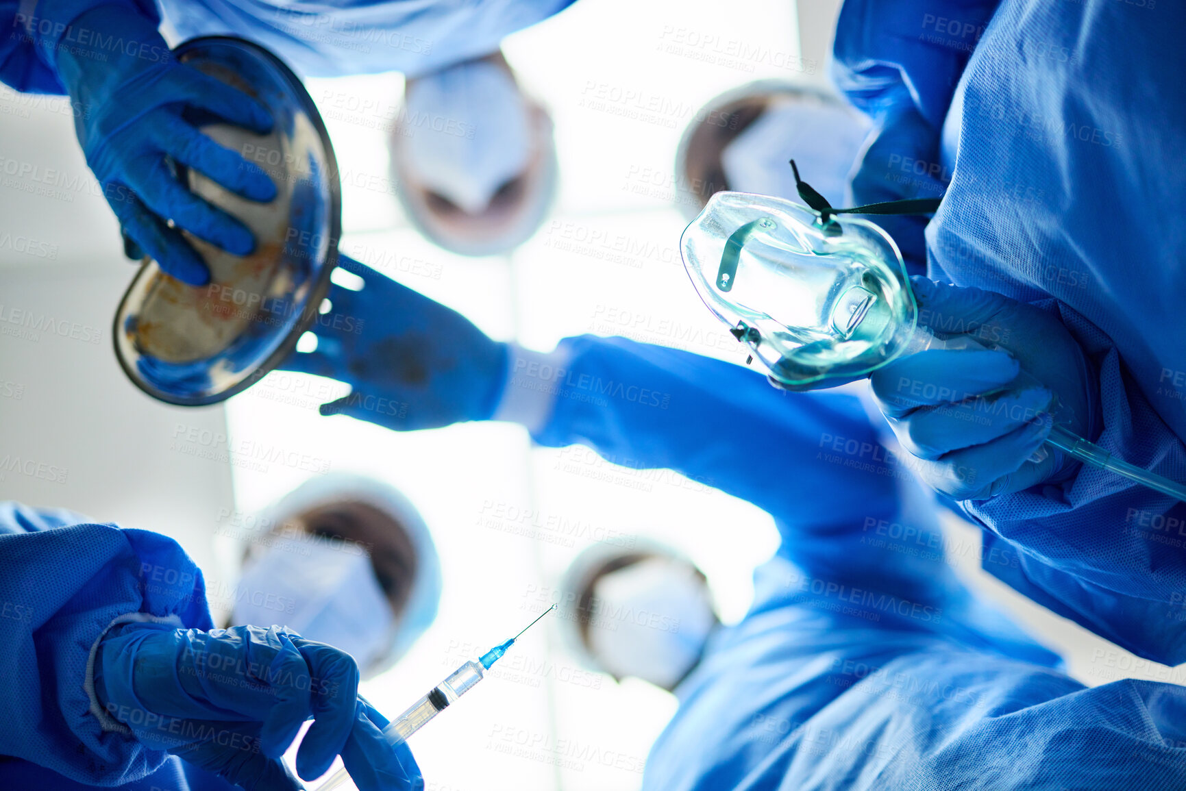 Buy stock photo Surgery team, below and a doctors in a hospital or theatre to start operation with anesthesia. Surgeon, assistant and medical group together for emergency healthcare with a oxygen mask and syringe