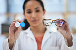 Hands, glasses and contact lens, woman with choice of eye care and help with optometry, vision and healthcare closeup. Doctor, frame and lenses container with decision, advice and ophthalmologist