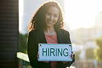 Happy woman, portrait and entrepreneur with hiring sign for small business growth or recruitment. Female person, employer or business manager with billboard or poster in recruiting or job opportunity