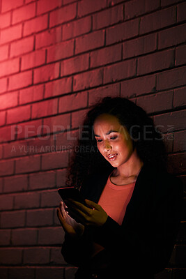 Buy stock photo Phone, city night wall and woman typing, search internet or check mobile info, app or contact social media user. Red neon light, communication and person networking, relax or research cellphone news