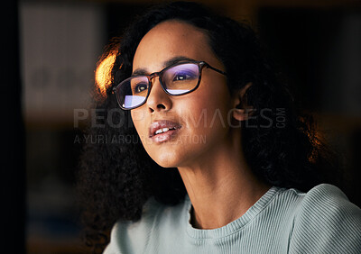 Buy stock photo Business woman, glasses and reading on computer for programming, software or information technology solution. Young night programmer in screen reflection for IT problem solving, results or web coding