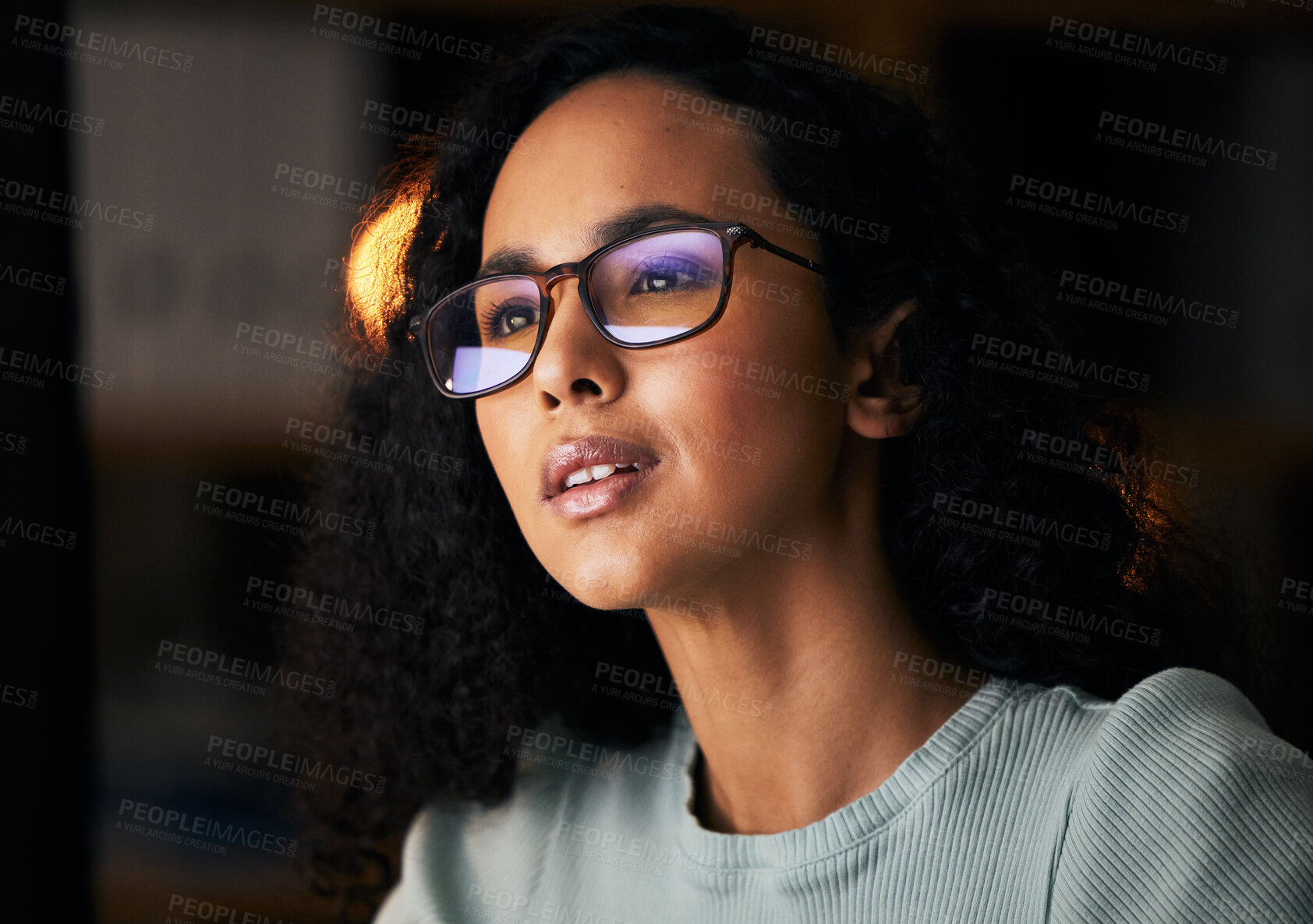 Buy stock photo Business woman, glasses and reading on computer for programming, software or information technology solution. Young night programmer in screen reflection for IT problem solving, results or web coding