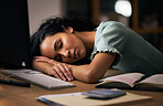 Night, business, and woman sleeping, tired and overworked with burnout, stress and exhausted in a workplace. Dark, person or employee with fatigue, nap at a desk and deadlines with rest or low energy
