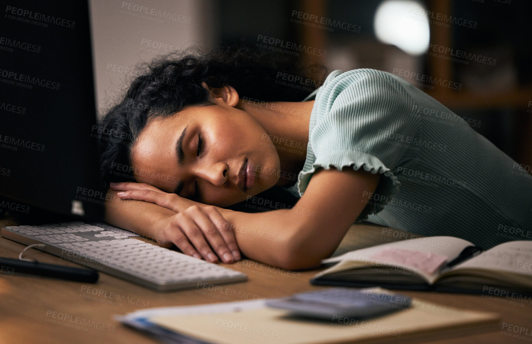 Buy stock photo Night, business, and woman sleeping, tired and overworked with burnout, stress and exhausted in a workplace. Dark, person or employee with fatigue, nap at a desk and deadlines with rest or low energy