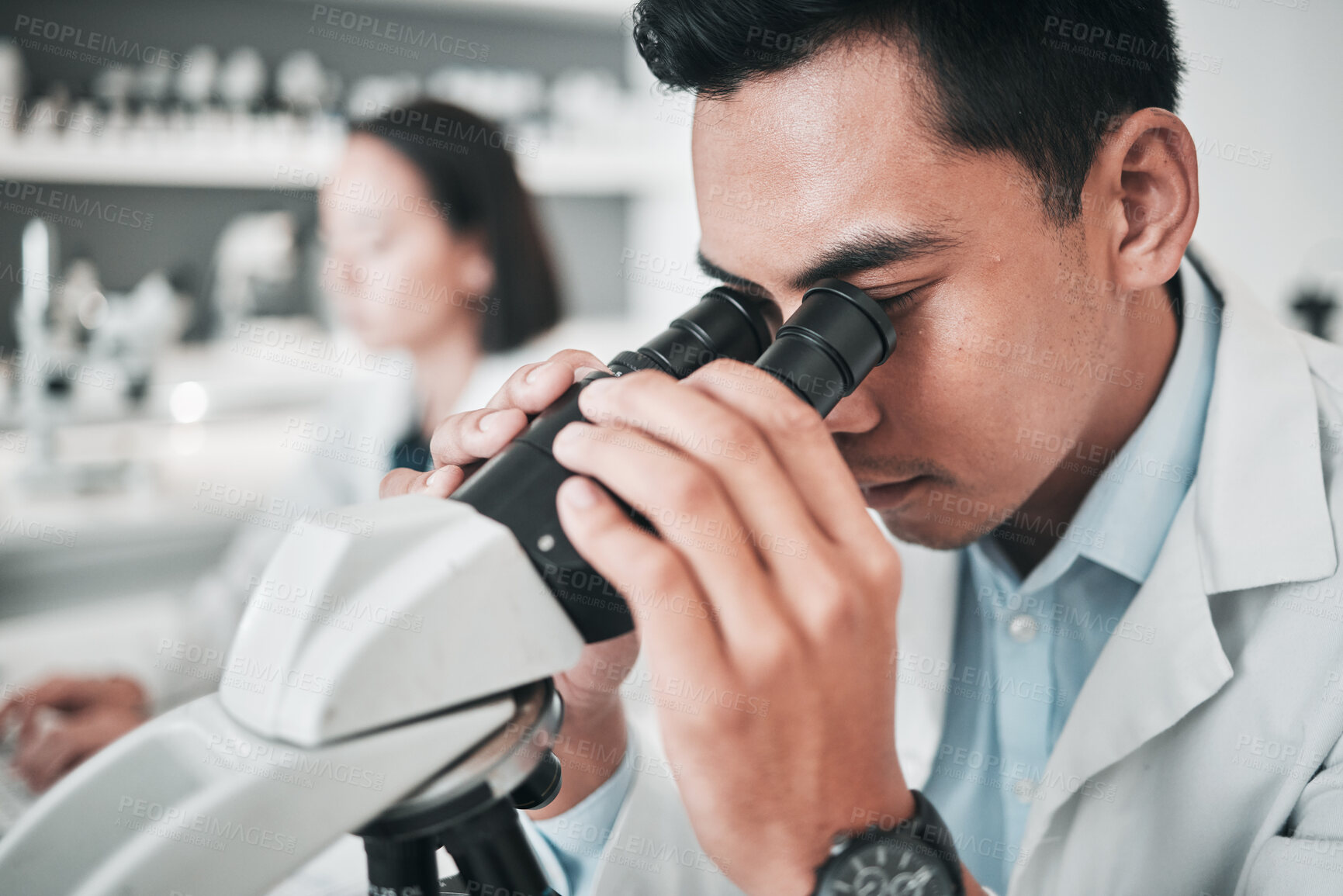 Buy stock photo Microscope, face and man in laboratory for medical  research, dna analysis or studying science, genes or particles. Scientist, biotechnology and lens for investigation, test or healthcare development