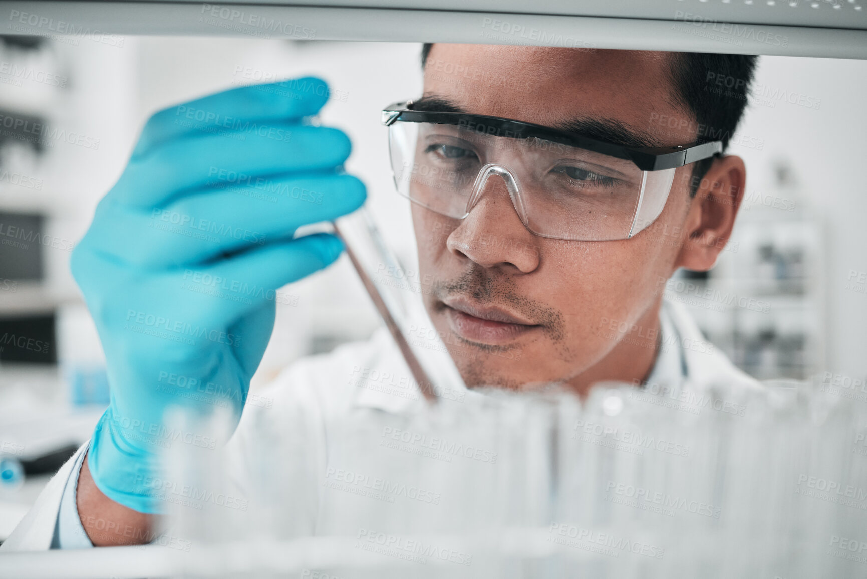 Buy stock photo Lab scientist, test tube and face of man in laboratory studying chemical analysis, pharma research and vaccine development. Science, asian chemistry technician and assessment of sample for innovation