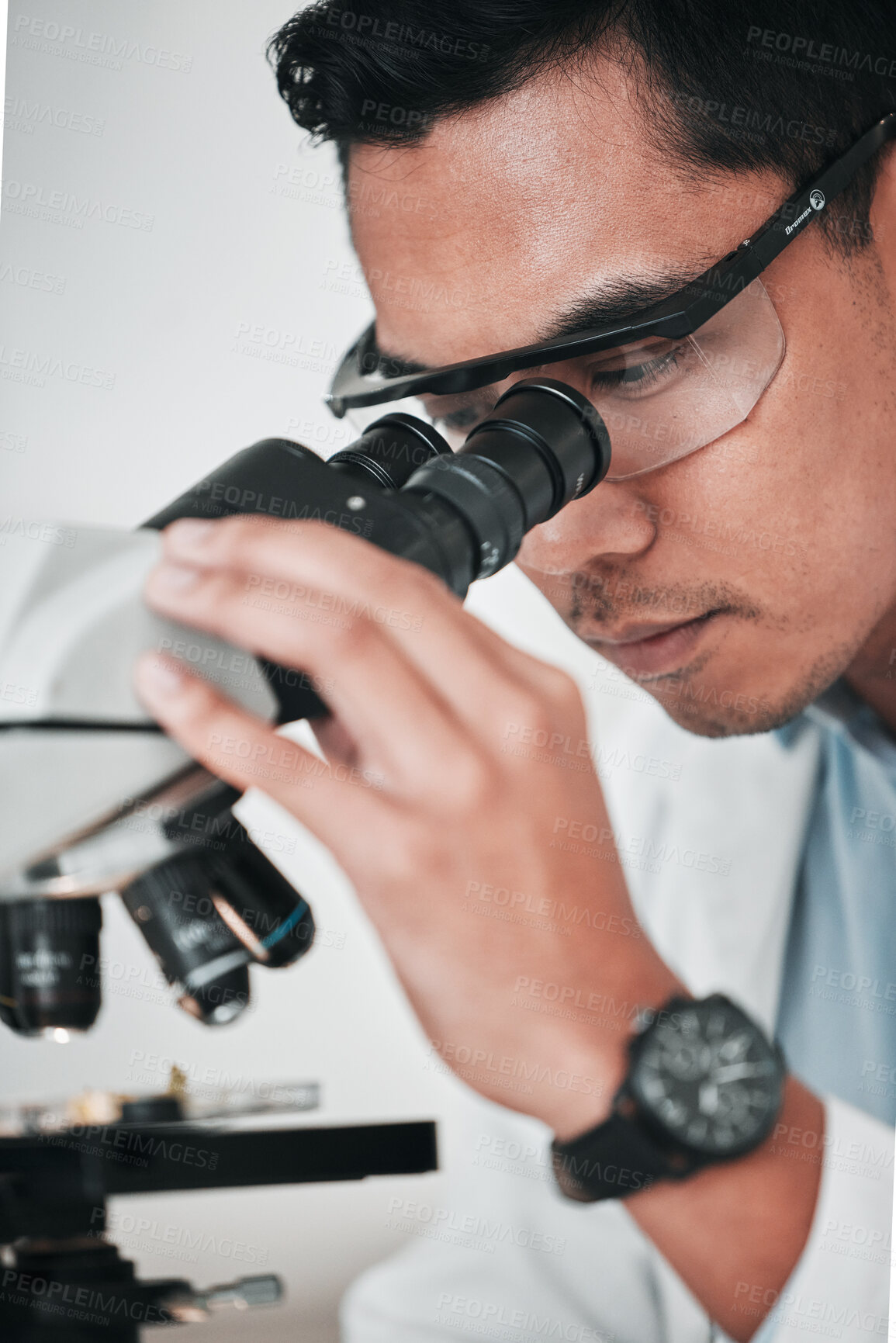 Buy stock photo Microscope, face of man and laboratory for science research, dna analysis and studying chemical development. Asian scientist, biotechnology and check lens to review investigation, test and assessment