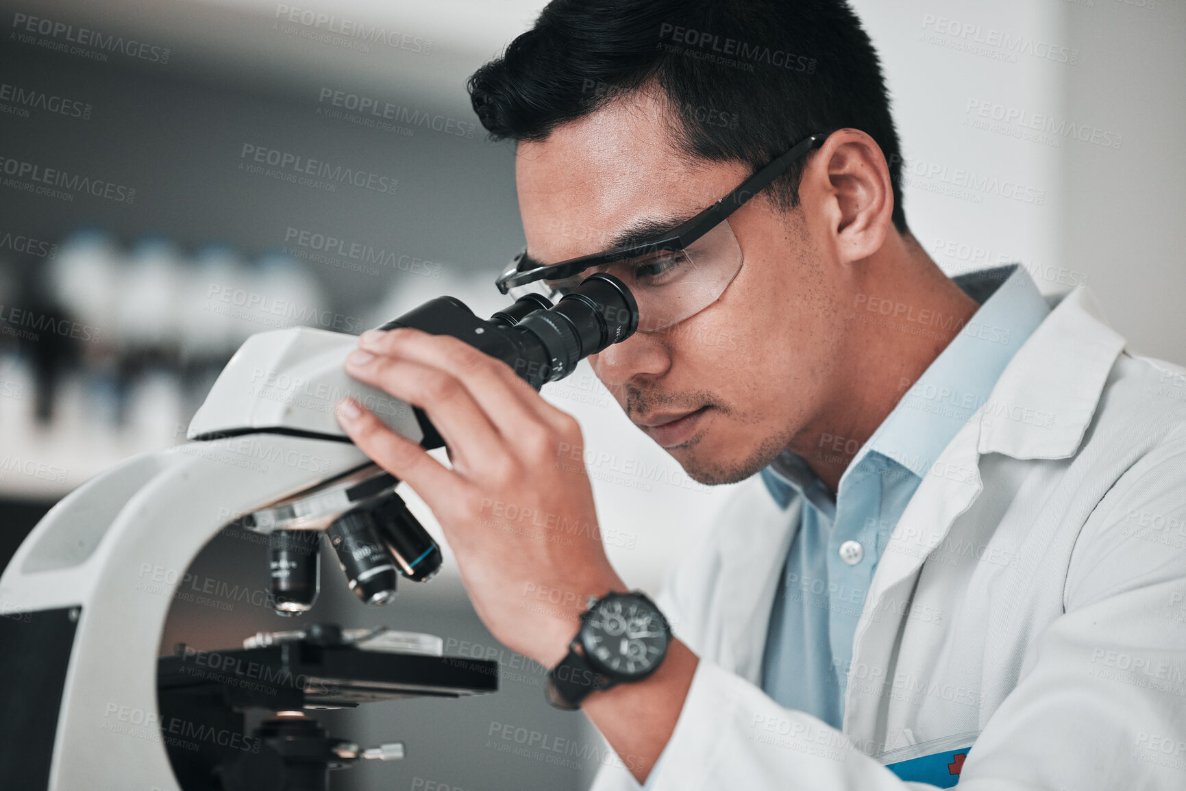 Buy stock photo Man, scientist and microscope in forensic science, research or new discovery at laboratory. Male person, medical or healthcare specialist looking in scope for DNA, vaccine or cure to virus in lab