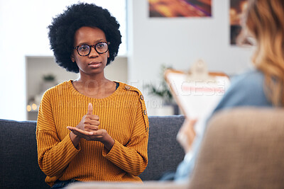 Buy stock photo Sign language, speech therapy and black woman talking to therapist in a consultation or counseling conversation. Communication, support and professional Psychologist help person with learning