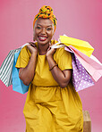 Shopping bag, studio portrait and happy black woman excited for discount promotion, boutique sales or commerce deal. Happiness, package gift or African customer with retail present on pink background