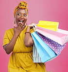 Shopping bag, studio and black woman surprise over discount notification, sales announcement or commerce deal. Wow, package gift and African customer shocked with retail news offer on pink background