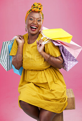 Buy stock photo Shopping bag, studio portrait and black woman excited for discount promotion, fashion spree choice or commerce deal. Market product, package or African customer with retail present on pink background