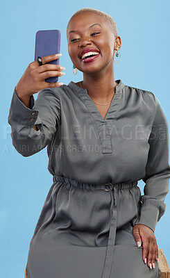 Buy stock photo Happy, selfie and black woman excited for mobile app video call isolated in studio blue background with prize. Connection, African and happy person or content creator live streaming on social media