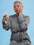 Phone, selfie and black woman beauty on app or video call isolated in studio blue background with style. Connection, African and influencer person or content creator live streaming on social media