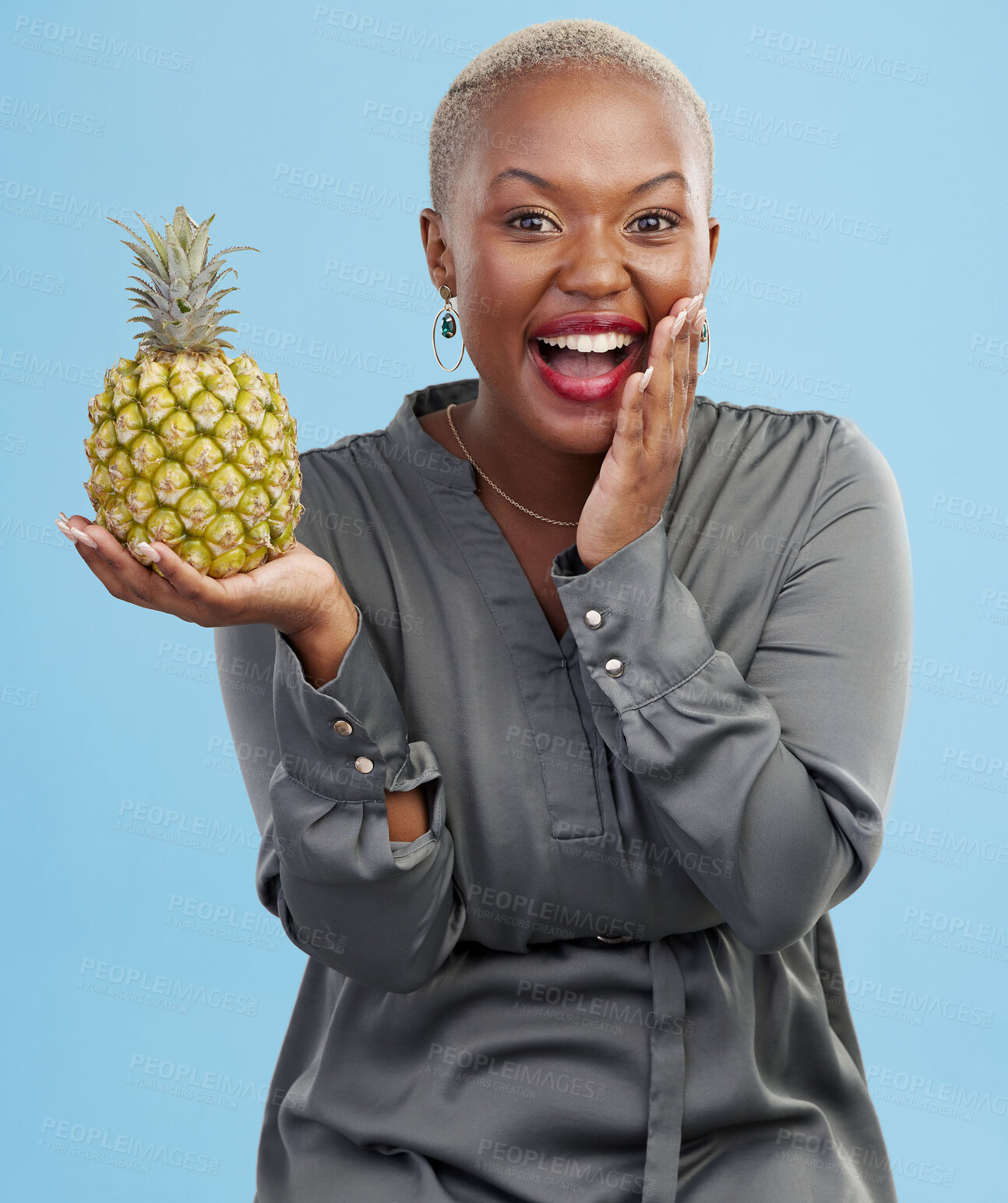 Buy stock photo Portrait, wow and black woman pineapple in studio for detox, lose weight or diet nutrition on blue background. Fruit, face and African lady nutritionist show vegan, lifestyle or organic diet choice