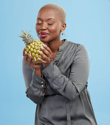 Buy stock photo Pineapple, diet and black woman in studio with advice, lose weight or digestion and gut health tips on blue background. Fruit, detox or African nutritionist with organic, raw and superfoods guide