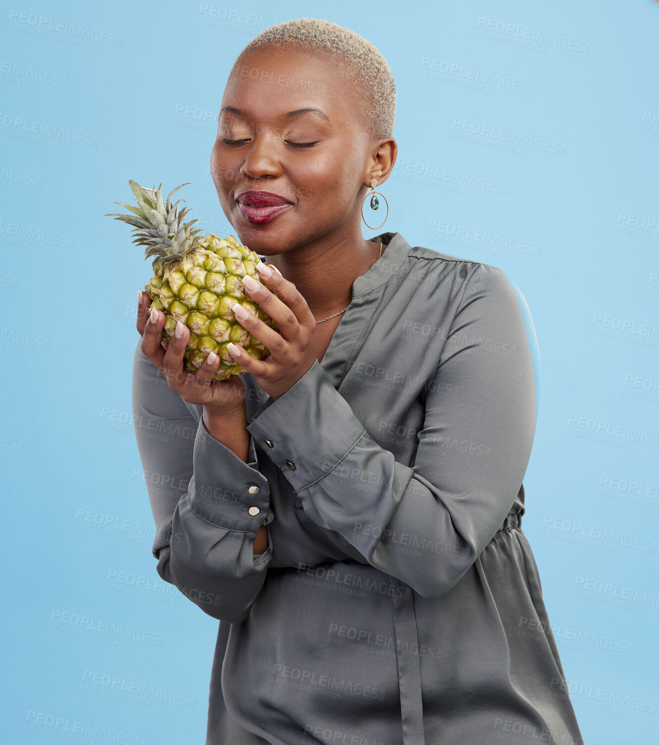 Buy stock photo Pineapple, diet and black woman in studio with advice, lose weight or digestion and gut health tips on blue background. Fruit, detox or African nutritionist with organic, raw and superfoods guide