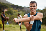 Fitness, stretching and portrait of a man outdoor for health and wellness. Happy runner, athlete or sports person in nature park to start exercise, workout or training with arm muscle warm up