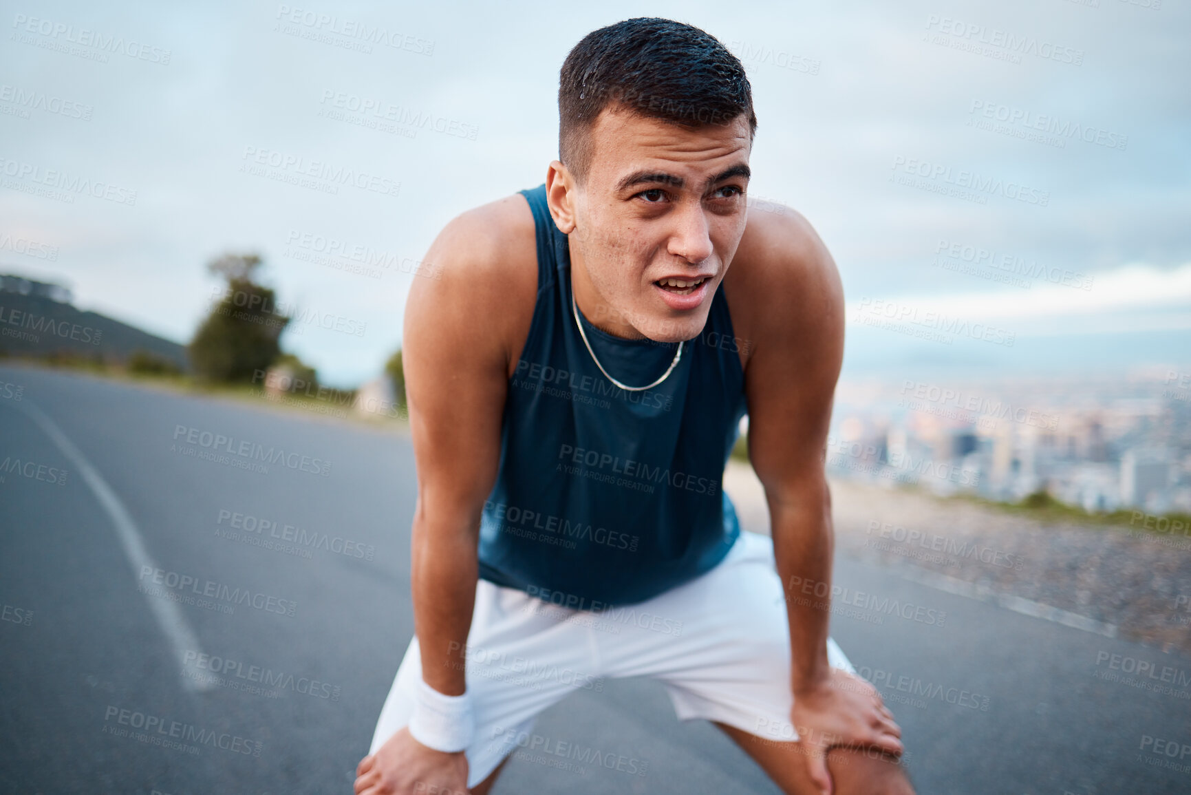 Buy stock photo Sports, nature and man athlete breathing after running for race, marathon or competition training on mountain. Fitness, workout and young male runner on a break for an outdoor cardio exercise.