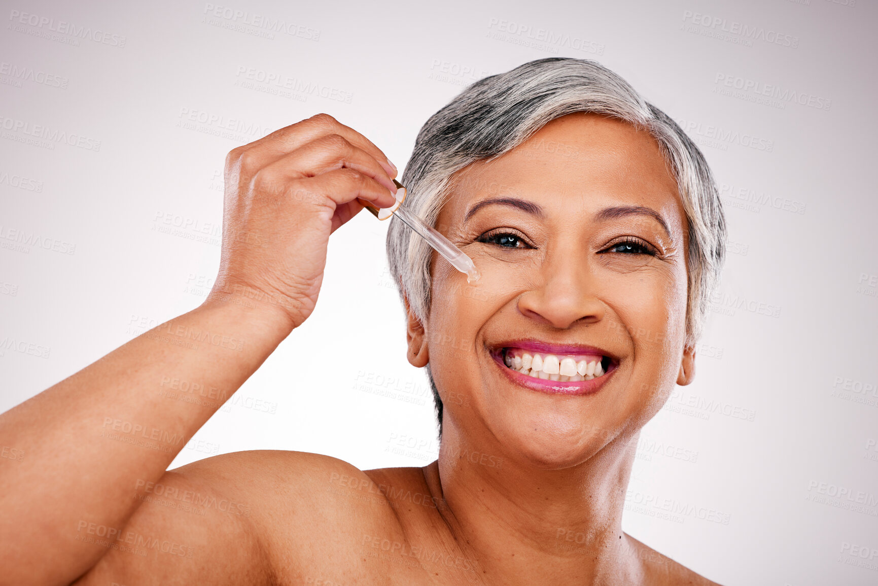 Buy stock photo Beauty, portrait and mature happy woman with serum skin hydration, anti aging product or collagen oil for spa skincare treatment. Liquid dropper, hyaluronic acid and studio face on white background