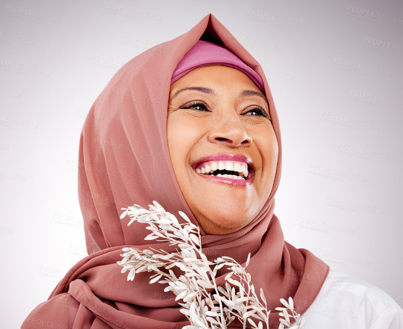 Buy stock photo Skincare, plant and face of Muslim woman in studio with makeup, cosmetics and natural beauty. Dermatology, happy and Islamic person with flowers on gray background for organic wellness products