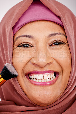 Buy stock photo Makeup brush, smile and portrait of muslim woman in studio for cosmetic, natural and face routine. Happy, self care and mature islamic female model with cosmetology tool for facial glamour treatment.