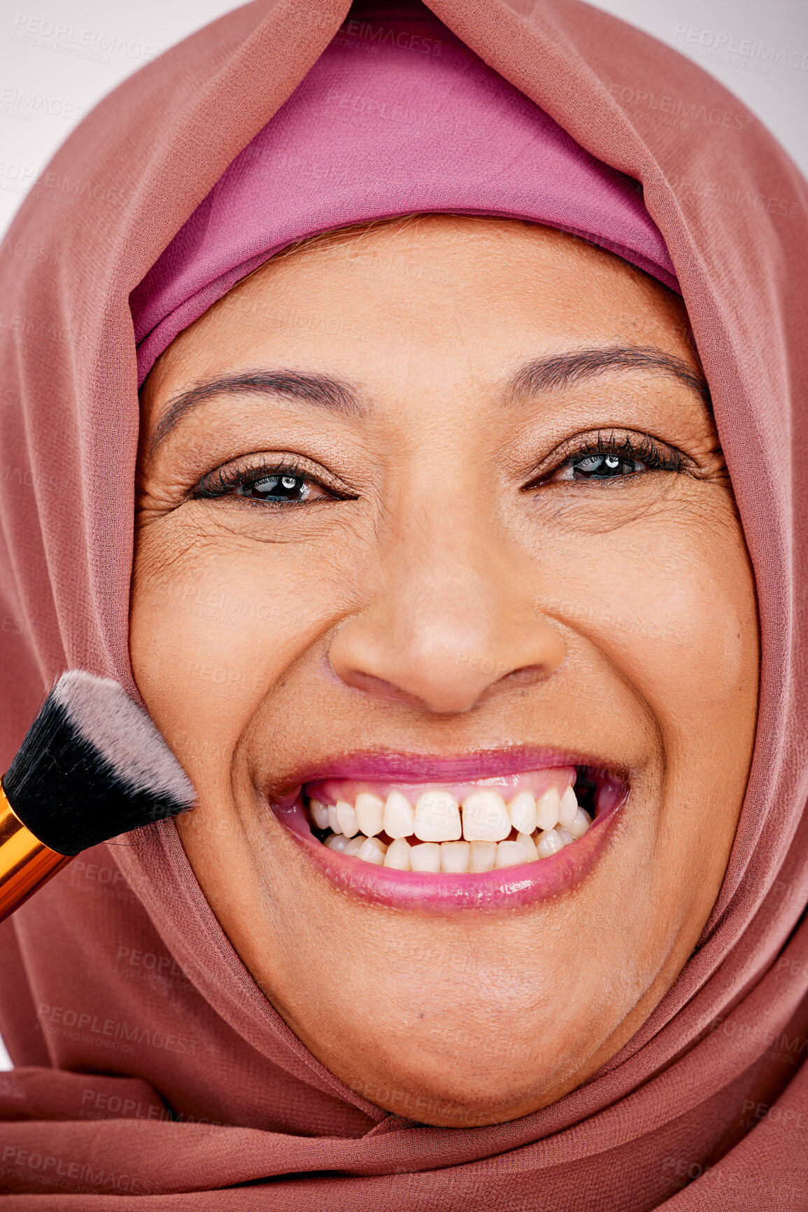 Buy stock photo Makeup brush, smile and portrait of muslim woman in studio for cosmetic, natural and face routine. Happy, self care and mature islamic female model with cosmetology tool for facial glamour treatment.