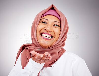 Buy stock photo Blow kiss, happy and portrait of Muslim woman in studio with makeup, cosmetics and beauty. Fashion, style and face  of Islamic person with hand gesture for love, affection or emoji on gray background