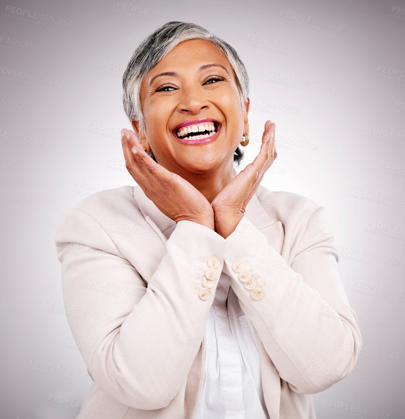 Buy stock photo Portrait, funny and a mature business woman laughing in studio on a gray background for smile or professional growth. Comic, corporate and face frame with happy professional looking confident in suit