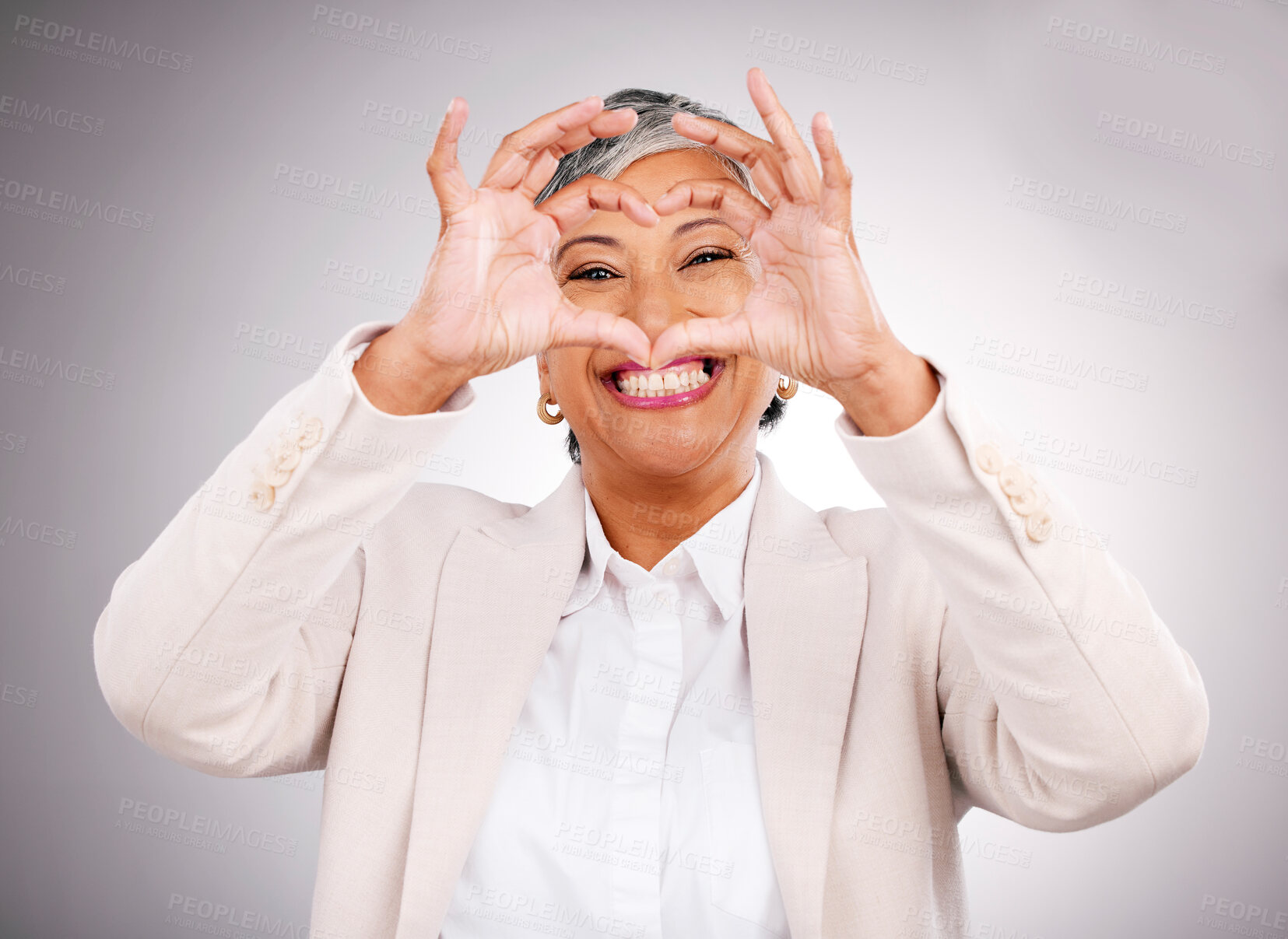 Buy stock photo Hands in heart, business and portrait of woman for success, support and charity in studio. Success, corporate and face of mature person with hand gesture for love, yes and emoji on gray background