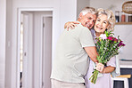 Love, portrait and senior couple hug with flowers for birthday, surprise or anniversary in their home. Face, romance and elderly man hug woman with bouquet for retirement, celebration or gift gesture