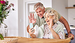 Senior couple, video call and wave with phone, conversation and contact on social media in retirement. Happy elderly man, woman and webinar with smartphone, smile and hello in morning, house or table